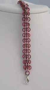 Anodized aluminum rings and aluminum beads colors: red and pink weave: back to work size: 3/8 x 7  3/4